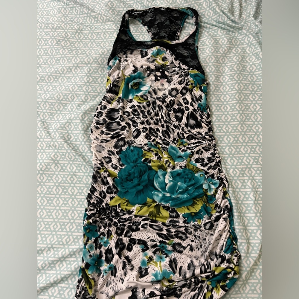 April dress with cheetah print and blue flowers displayed